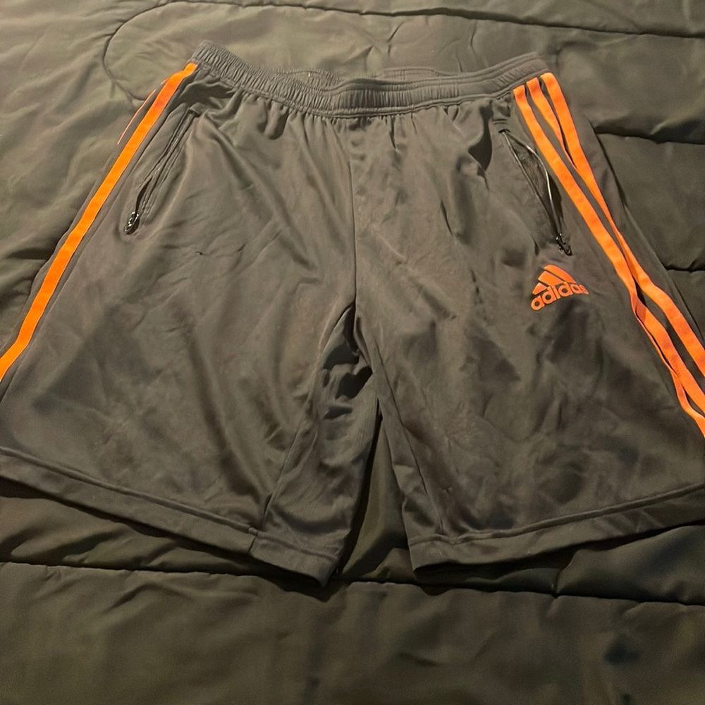 Black and orange adidas shorts